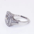 Three-quarter side angle of 2 carat cushion cut lab diamond ring with split shank and vintage milgrain halo.