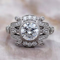 Overhead studio view of 2 CT round brilliant lab grown diamond featuring an ornate vintage filigree setting.