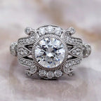 Overhead studio view of 2 CT round brilliant lab grown diamond featuring an ornate vintage filigree setting.