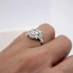 On-hand profile view displaying raised vintage setting and micro-pavé filigree band detailing.