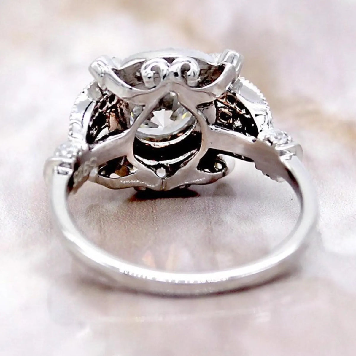 Underside view displaying intricate openwork filigree gallery and interior band craftsmanship.