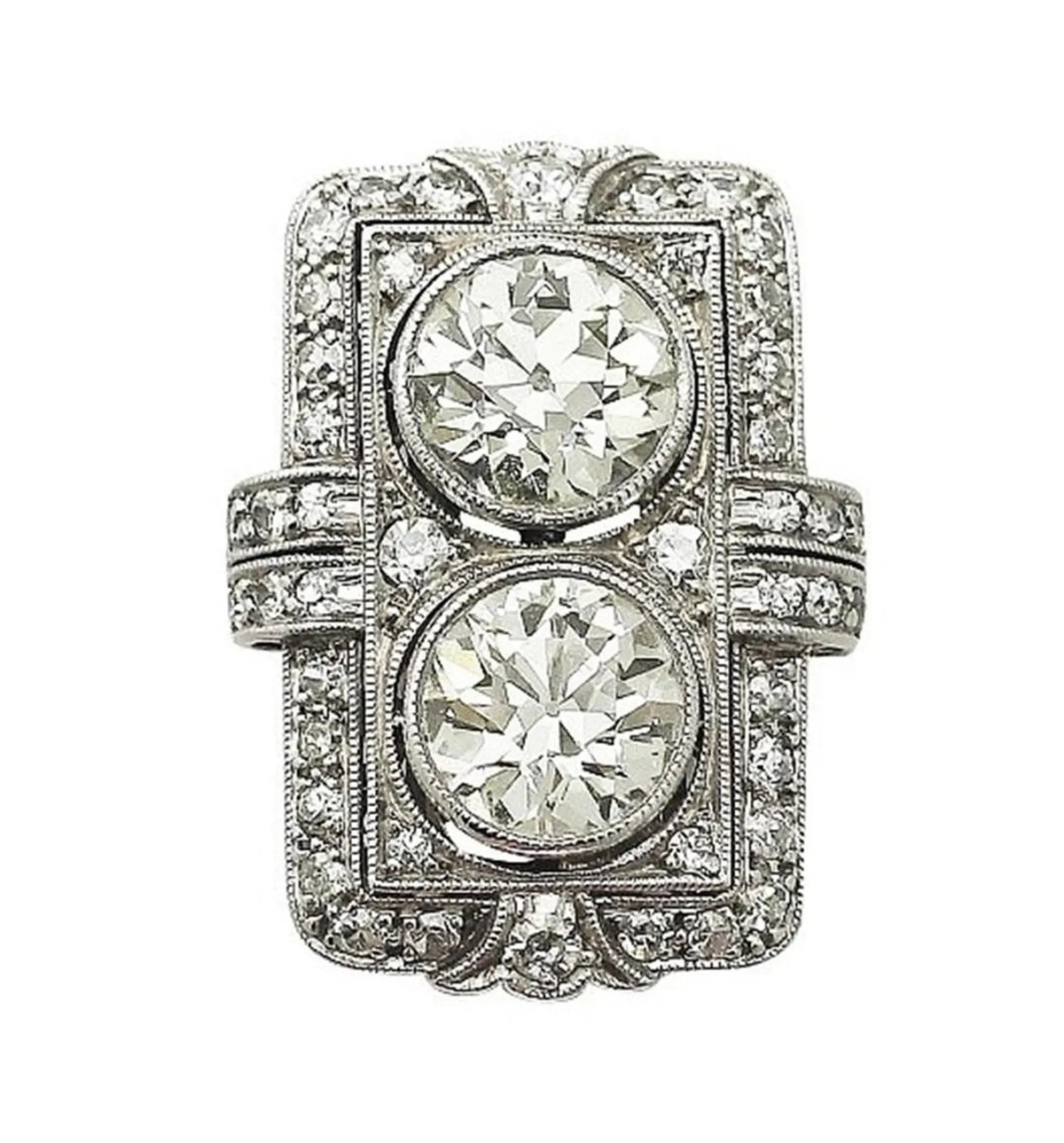 Top-down studio shot of Art Deco two-stone round lab grown diamond shield ring with geometric pavé frame.