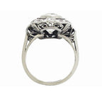 Underside view of Art Deco lab diamond plaque ring revealing openwork filigree under-gallery arch.