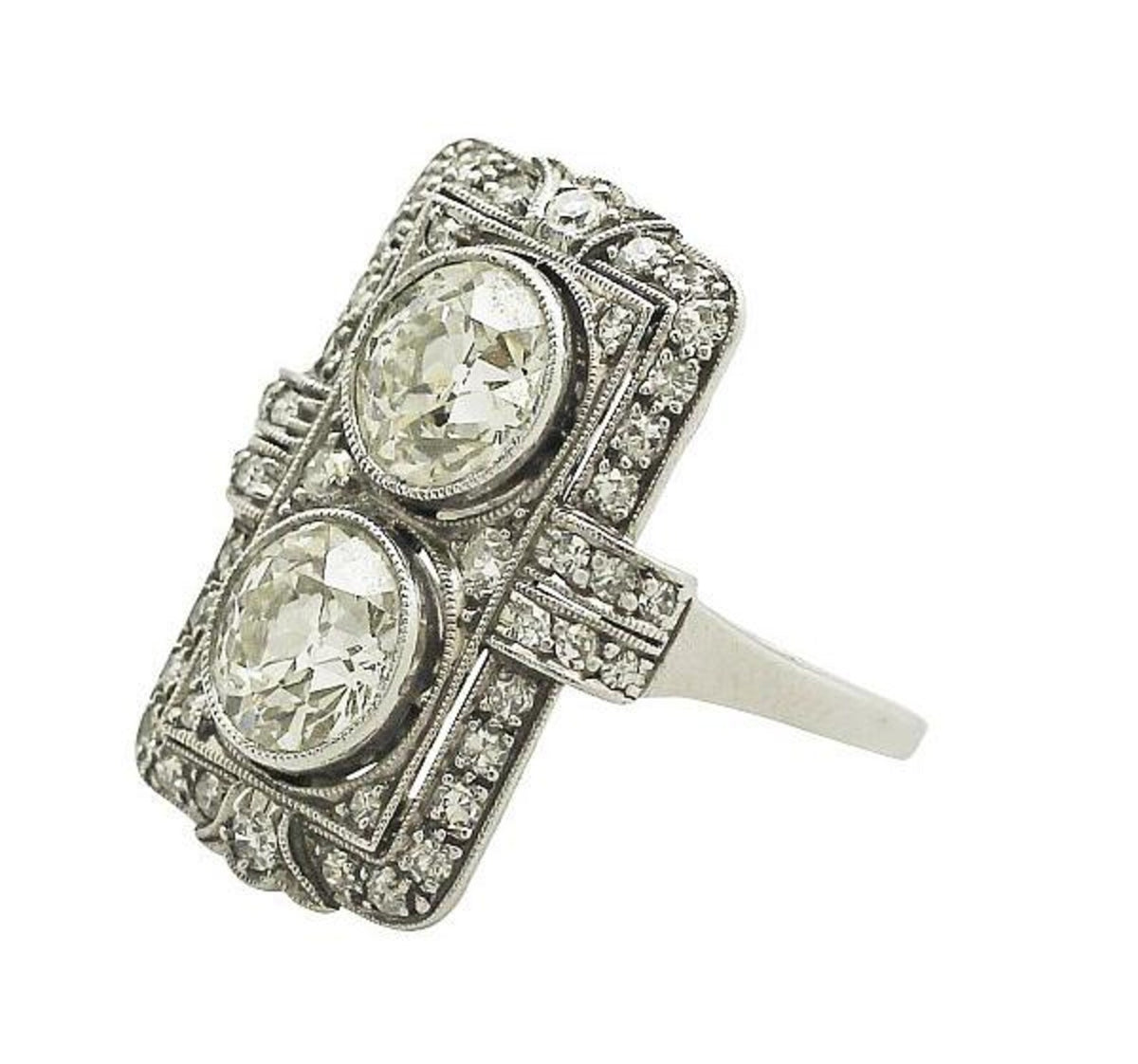 Elevated side profile view of two-stone round lab grown diamond shield ring isolated on white background.