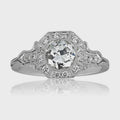Overhead studio shot of 2 CT round cut lab grown diamond ring with octagonal halo and mirror reflection.