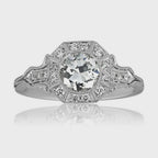 Overhead studio shot of 2 CT round cut lab grown diamond ring with octagonal halo and mirror reflection.