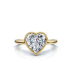 3ct heart-shaped diamond ring featuring a beaded milgrain bezel and polished yellow gold band on a clean white background.
