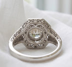 Underside openwork gallery view of a 2 CT round lab grown diamond engagement ring showing intricate filigree lattice detail.