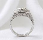 Direct side view of an Art Deco bezel set lab diamond ring highlighting the filigree arch bridge and smooth metal band.