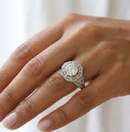 On-hand perspective of a vintage-style 2 CT round lab-grown diamond bezel engagement ring in white gold.