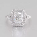 Top-down view of a 3 CT radiant cut lab-grown diamond ring with a diamond halo and split-shank pavé band