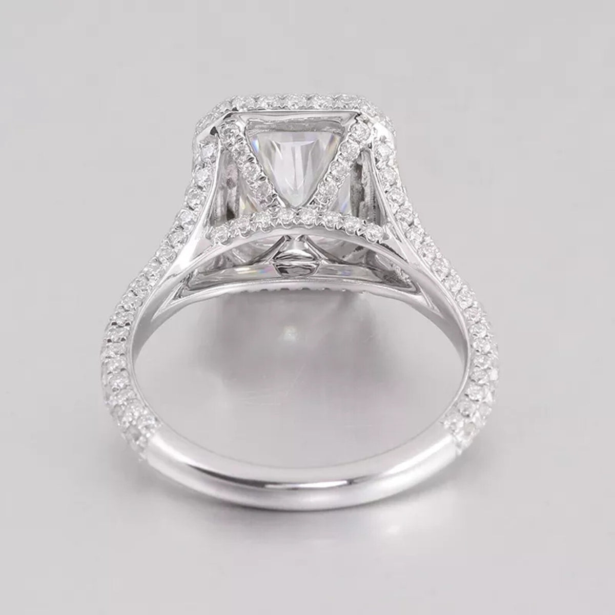 Underside profile of a radiant lab diamond ring showing the micro-pavé detailed basket bridge and band.