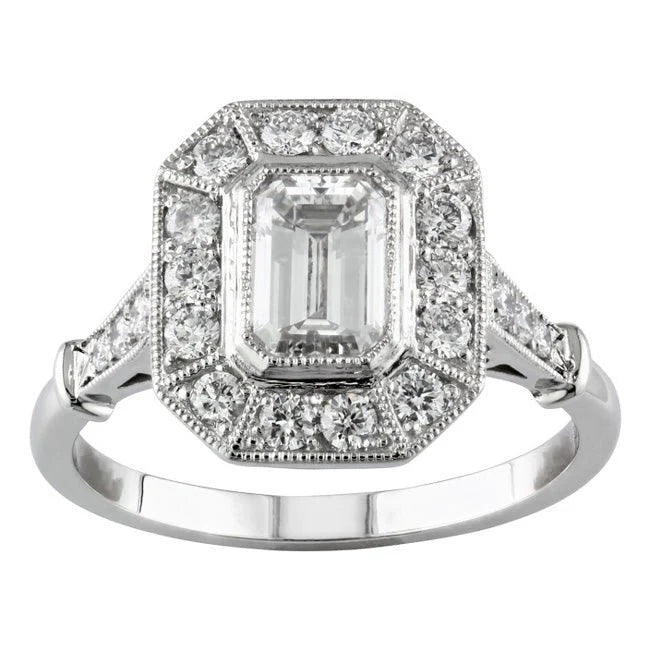 Front view of a 2 carat emerald cut lab diamond ring featuring an inner bezel and vintage octagonal milgrain halo.
