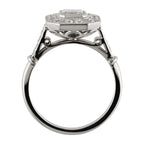 Side profile view of a vintage Art Deco emerald cut lab diamond ring highlighting the geometric openwork gallery undercage.