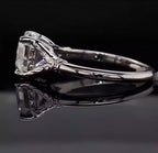 Side profile view of a 3 CT Asscher cut lab grown diamond ring with intricate vintage scrollwork basket on a reflective background.