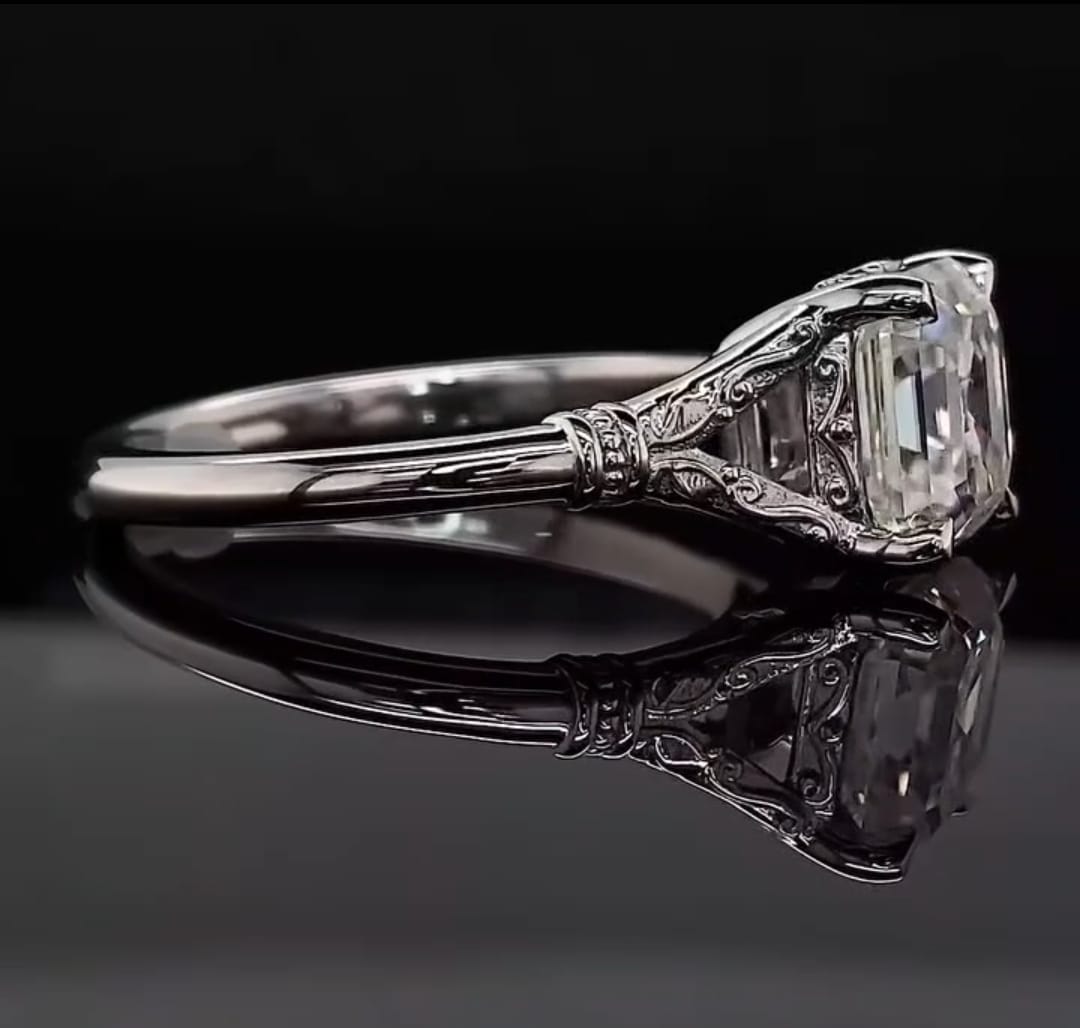 Side view showcasing the hand-engraved filigree shoulder and scrollwork basket of a 3 carat Asscher lab diamond ring.