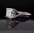 Angled view displaying the step-cut clarity and filigree split-shoulder setting of a 3 CT Asscher cut lab diamond ring.