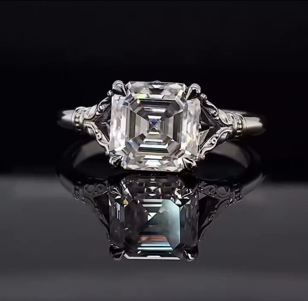 Top-down view of a 3 CT Asscher cut lab grown diamond showcasing its geometric step-cut facets and square silhouette.