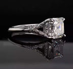 Profile perspective of a vintage-inspired 3 CT Asscher cut lab grown diamond engagement ring with filigree details.