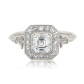 Front top-down view of 2 CT Asscher cut lab grown diamond ring featuring a vintage Art Deco halo and milgrain borders.