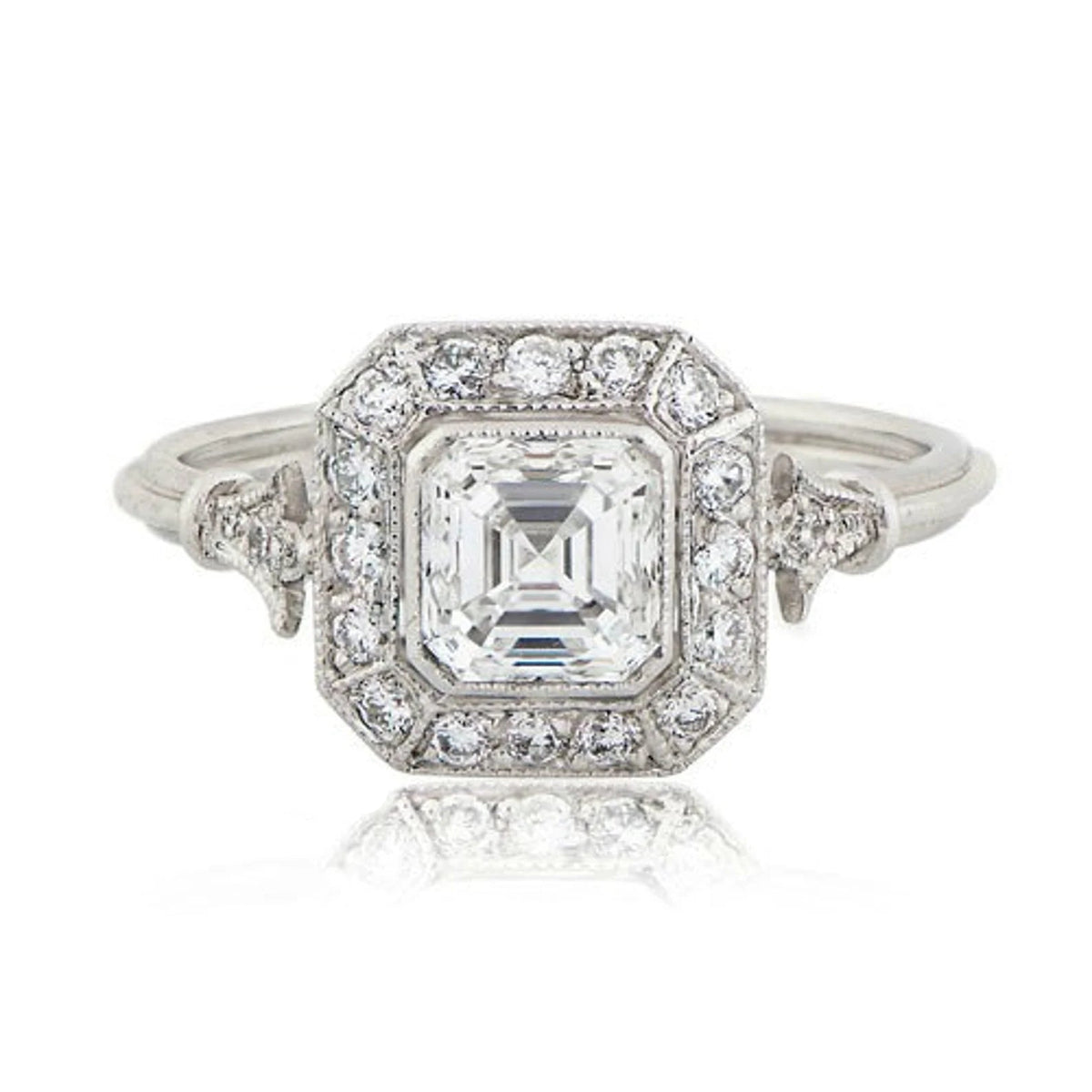 Front top-down view of 2 CT Asscher cut lab grown diamond ring featuring a vintage Art Deco halo and milgrain borders.
