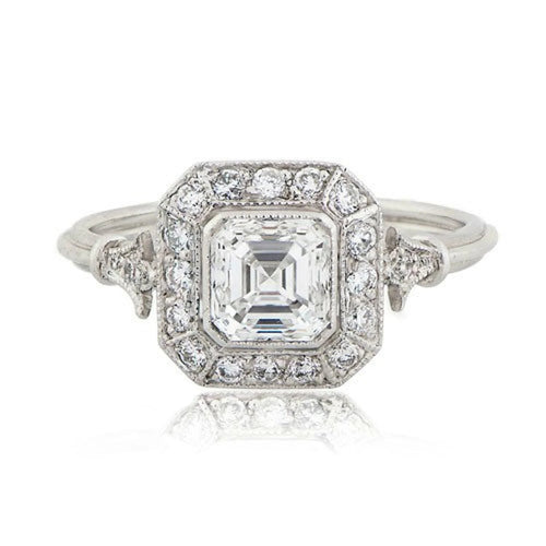 Front top-down view of 2 CT Asscher cut lab grown diamond ring featuring a vintage Art Deco halo and milgrain borders.