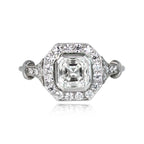 Top-down view displaying a 2 CT Asscher cut lab diamond set in an octagonal milgrain halo with diamond-accented shoulders.