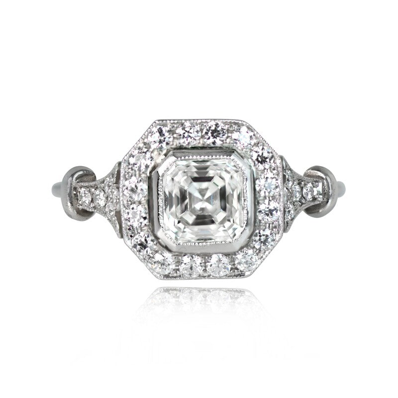 Top-down view displaying a 2 CT Asscher cut lab diamond set in an octagonal milgrain halo with diamond-accented shoulders.