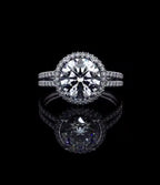 Direct top view of 3 carat round brilliant lab diamond in a micro pavé halo setting with split band.