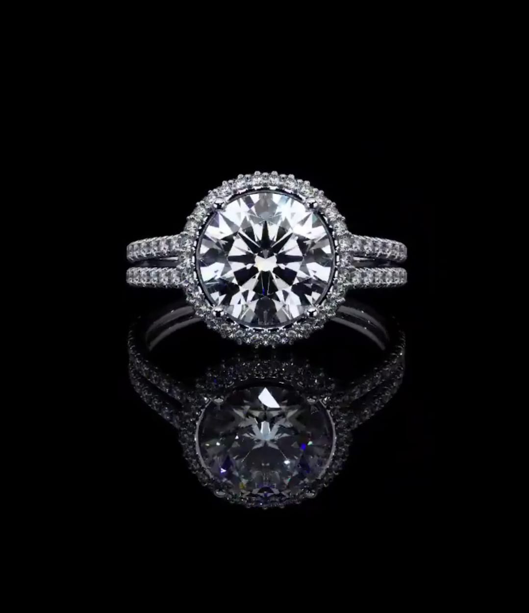 Direct top view of 3 carat round brilliant lab diamond in a micro pavé halo setting with split band.