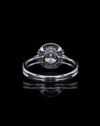 Direct bottom profile showing the open basket and culet setting of a round lab grown diamond halo ring.