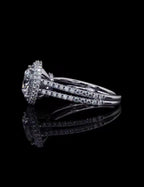 Profile reflection image of a 3 CT round lab diamond engagement ring featuring a raised halo basket and double band.