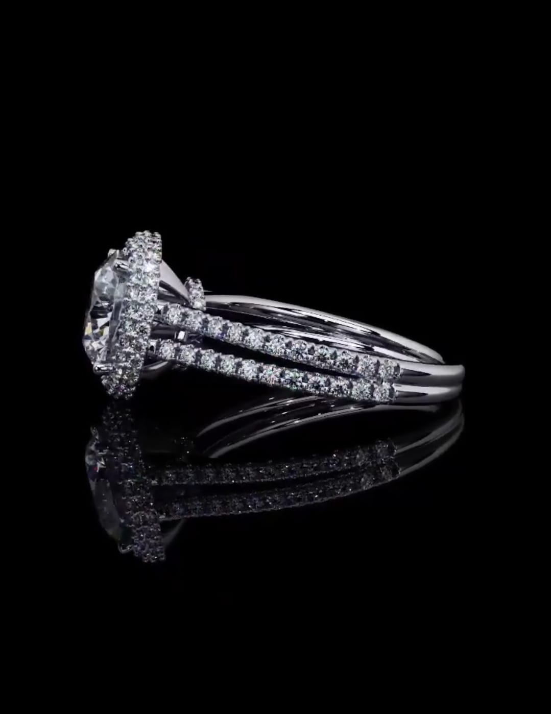 Profile reflection image of a 3 CT round lab diamond engagement ring featuring a raised halo basket and double band.