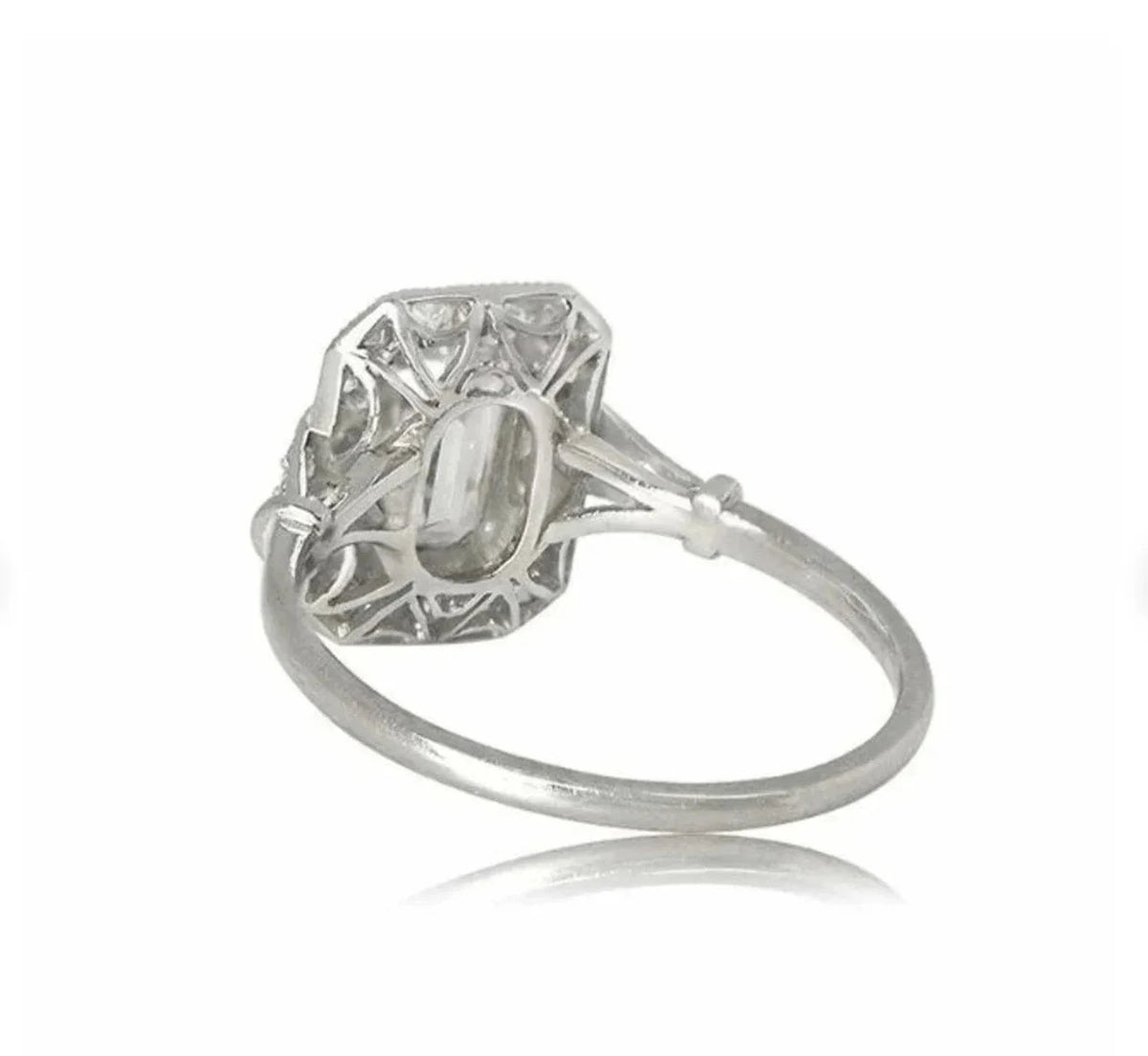 Perspective bottom view of an Art Deco emerald cut lab diamond ring showcasing intricate gallery lattice work.