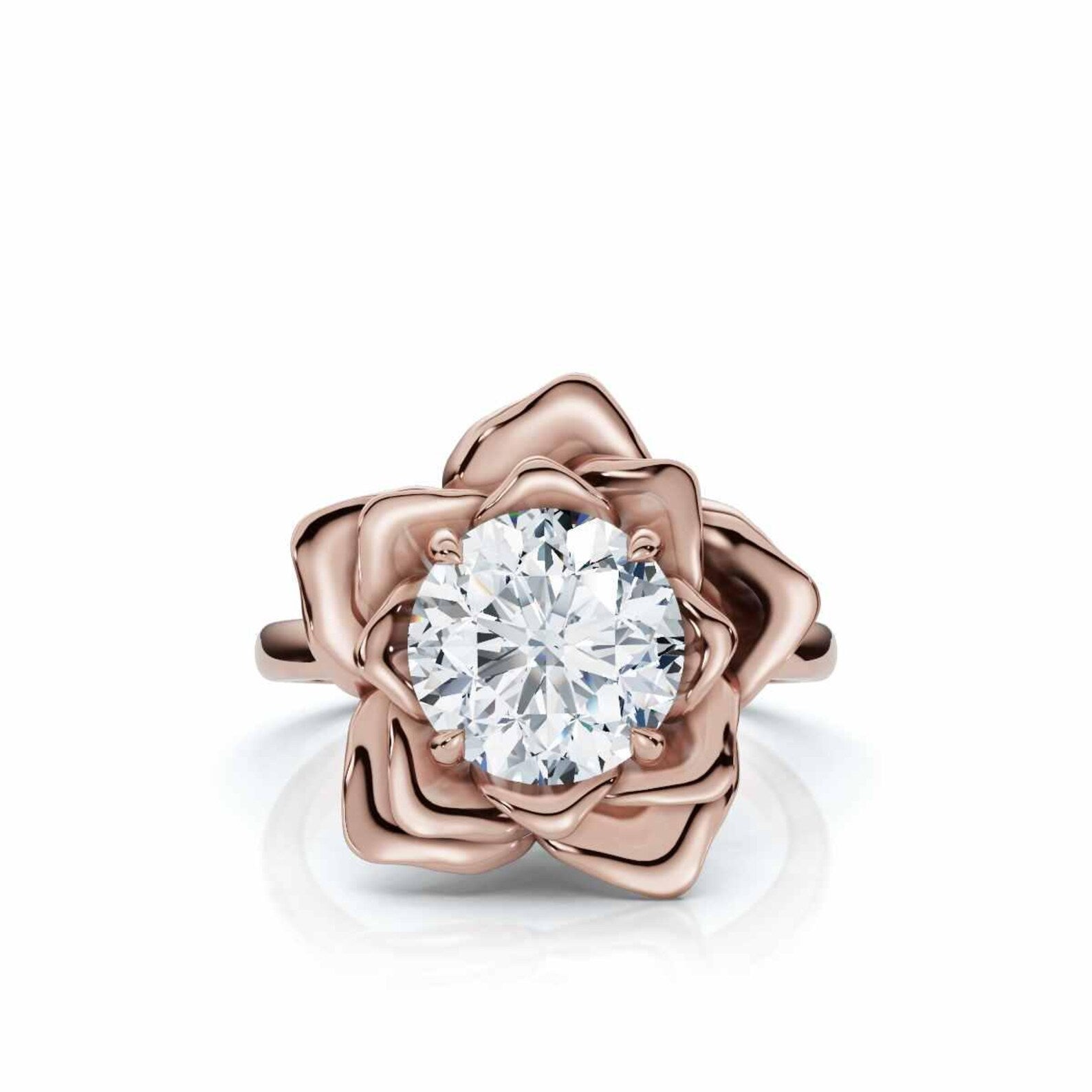 Top-down view of a 3 carat round cut lab grown diamond set inside a rose gold flower petal ring setting.