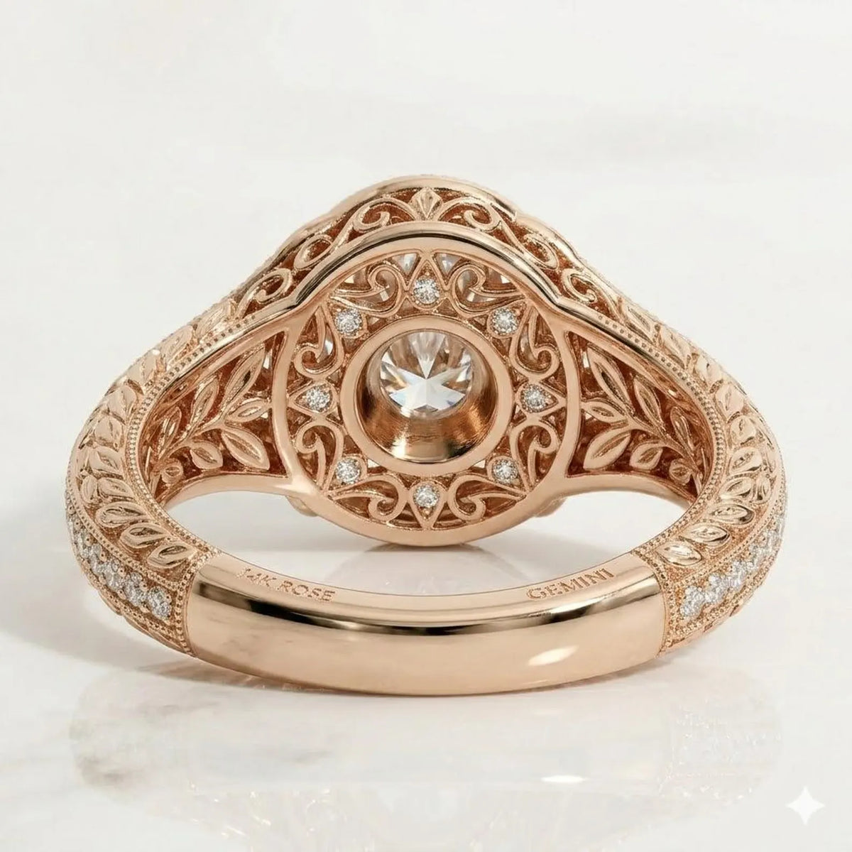 Underside view displaying intricate filigree scrollwork undergallery with a secret diamond halo and 14K Rose gold hallmark stamp.