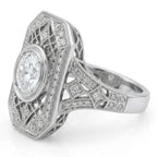 Side angle view of a vintage platinum shield ring showing pave-set diamond shoulders and openwork geometric lattice side walls.