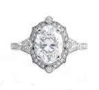 On-hand view of a 3 carat oval lab grown diamond scalloped vintage engagement ring in yellow gold.