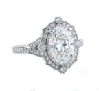Close-up three-quarter angle view of a yellow gold scalloped halo oval diamond engagement ring.