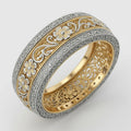 Two-tone vintage floral filigree wedding band showing silver flowers on a gold background with milgrain borders.