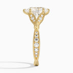 Side view of 2 CT pear cut lab diamond engagement ring in yellow gold showing pave band and diamond-paved petal prongs.