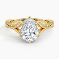 Top-down view of a 2 CT pear cut lab grown diamond set in a yellow gold botanical basket ring.