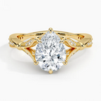 Top-down view of a 2 CT pear cut lab grown diamond set in a yellow gold botanical basket ring.