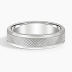 Front view of white gold men's wedding ring showcasing diamond-cut knurled pattern and sleek borders.