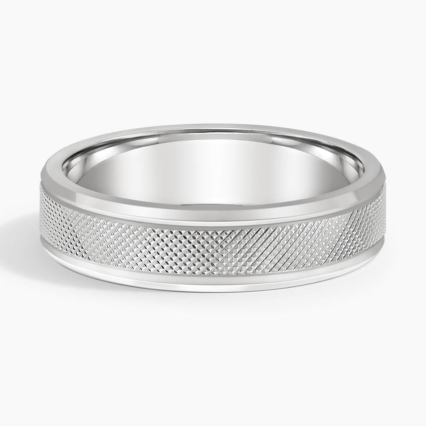 Front view of white gold men's wedding ring showcasing diamond-cut knurled pattern and sleek borders.