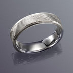 White gold men's textured band resting on reflective grey background showing smooth comfort-fit interior.