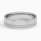 Front view of polished white gold men's wedding ring showing an offset line of brilliant diamonds.