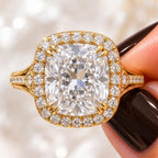 Top macro view of a 4 CT cushion cut lab grown diamond halo engagement ring in yellow gold with double claw prongs.