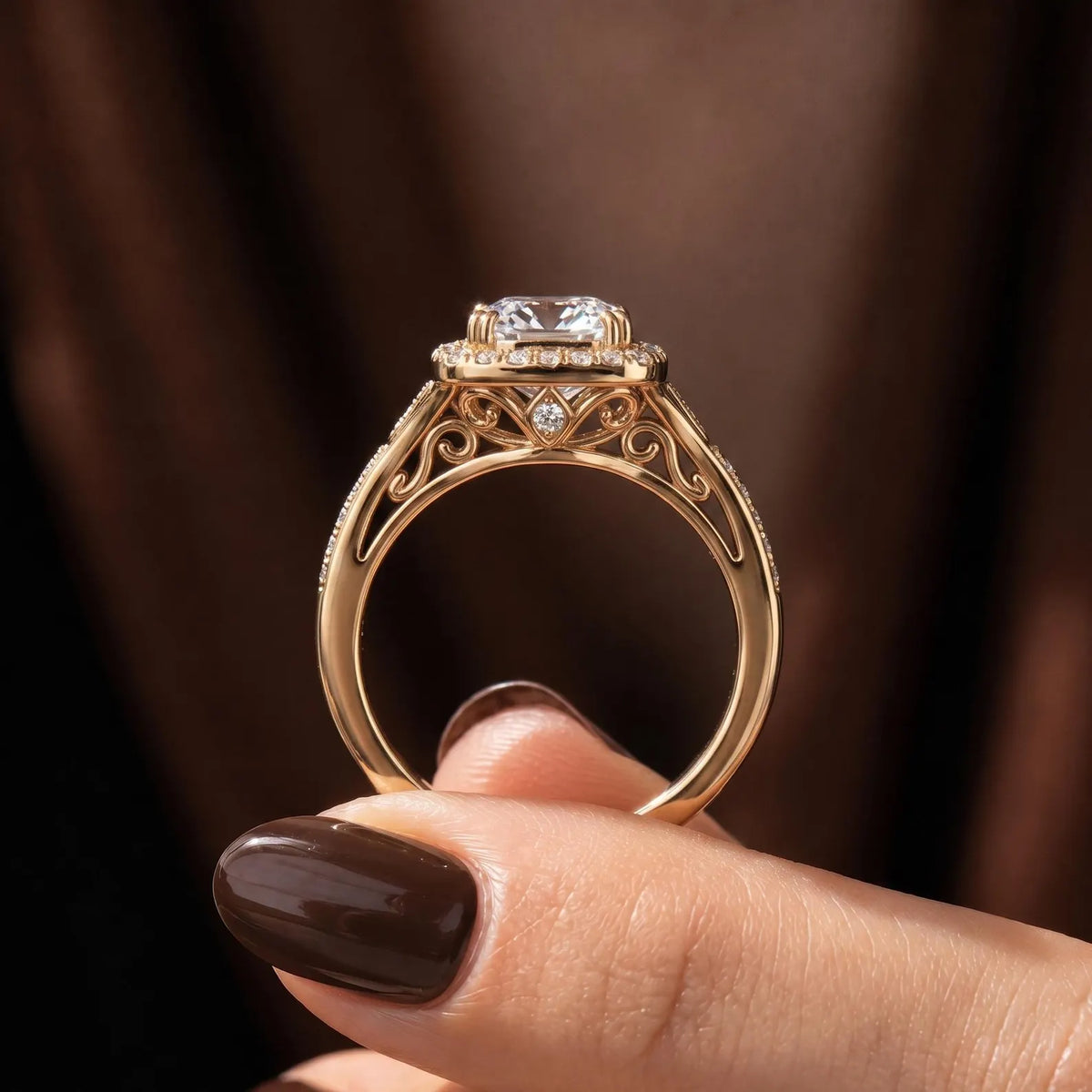 Side profile showing intricate vintage filigree scrollwork and hidden accent diamond beneath the cushion halo ring.