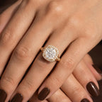 Elegant lifestyle image of 4 ct cushion cut lab grown diamond engagement ring worn on hand.